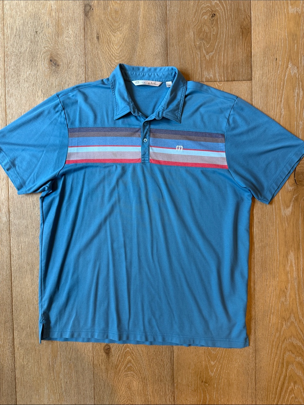 Travis Mathew Blue Men's Polo Shirt with Chest Stripe Detail